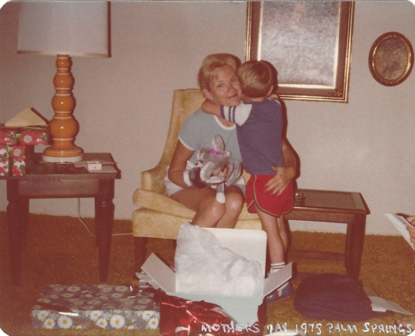 Boy hugs his mother on Mother's Day, 1975.