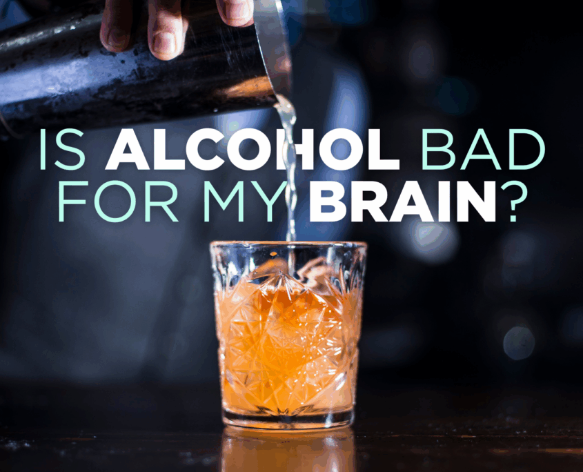 A blurred person in the background pours a metal tumbler of clear alcohol into a small glass of ice and orange-brown liquid. Type on the image says "Is alcohol bad for my brain?"
